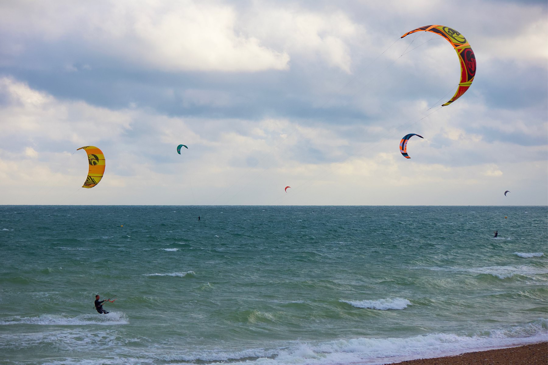 Kitesurfers in the sea off Shoreham Beach, West Sussex