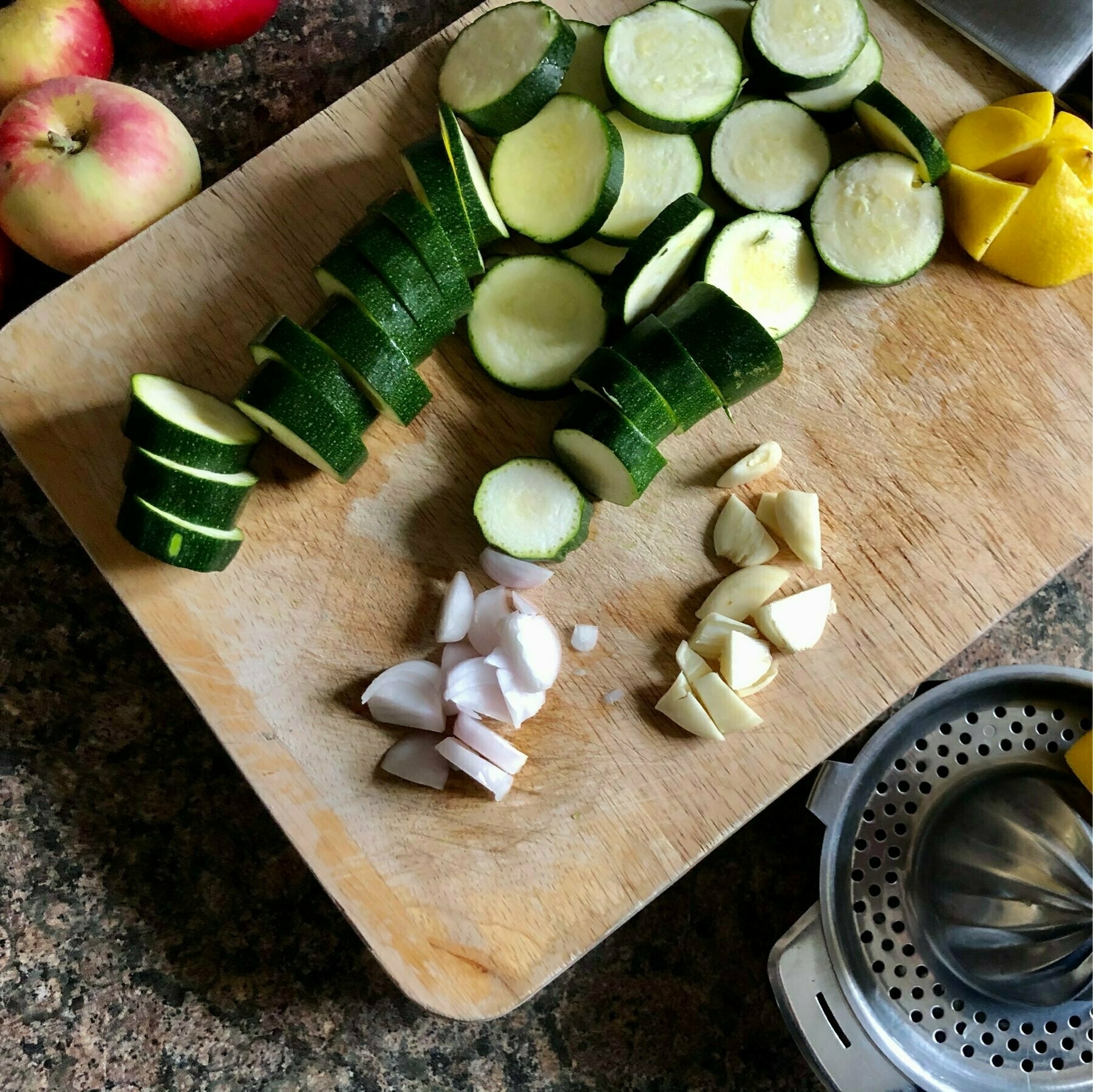 Chopping courgettes and shallots. 