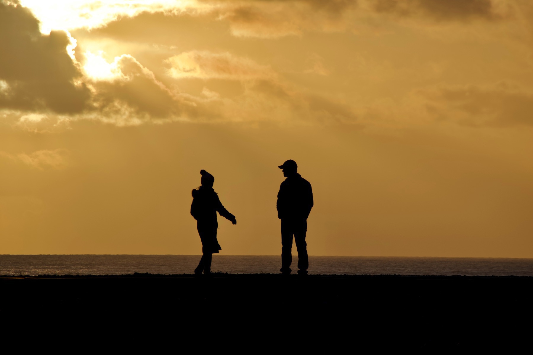 Silhouette of a couple on Shoreham Beach.