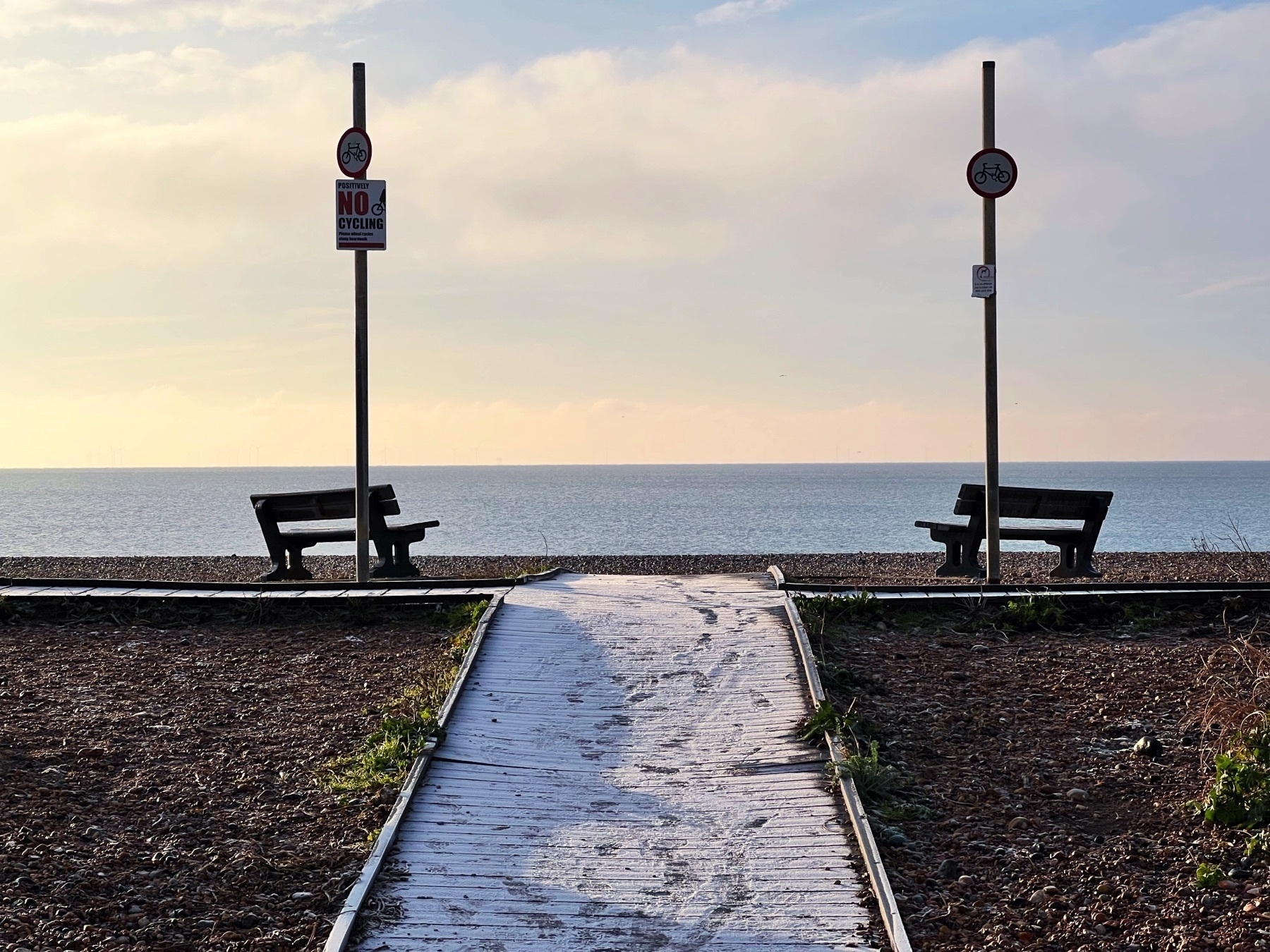 The Shoreham Beach boardwalk coated in frost on a winter’s morning. 