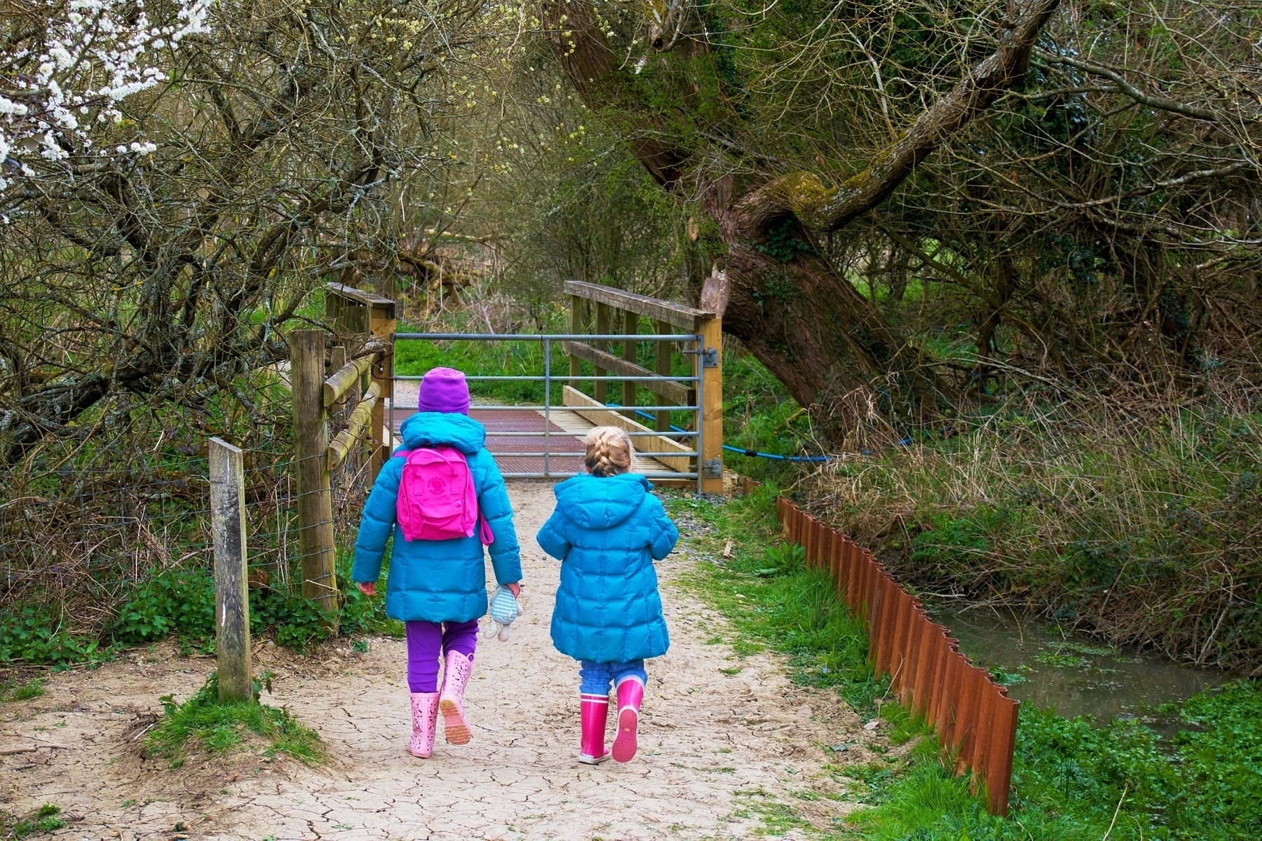 Two younb girls walking at Woods Mill in Sussex. 
