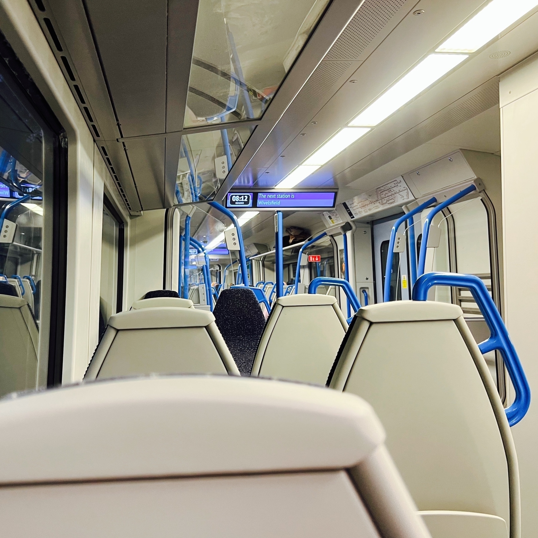 The inside of a Thameslink train carriage. 