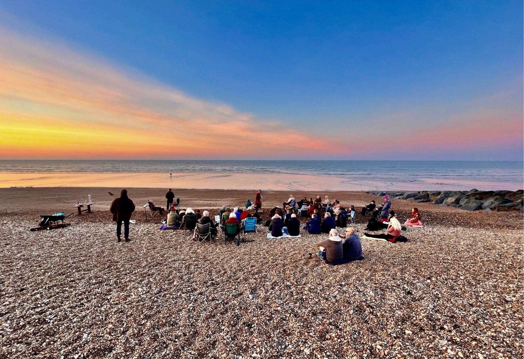 A church congregation meets on Shireham Beach to welcome Easter Sunday. 
