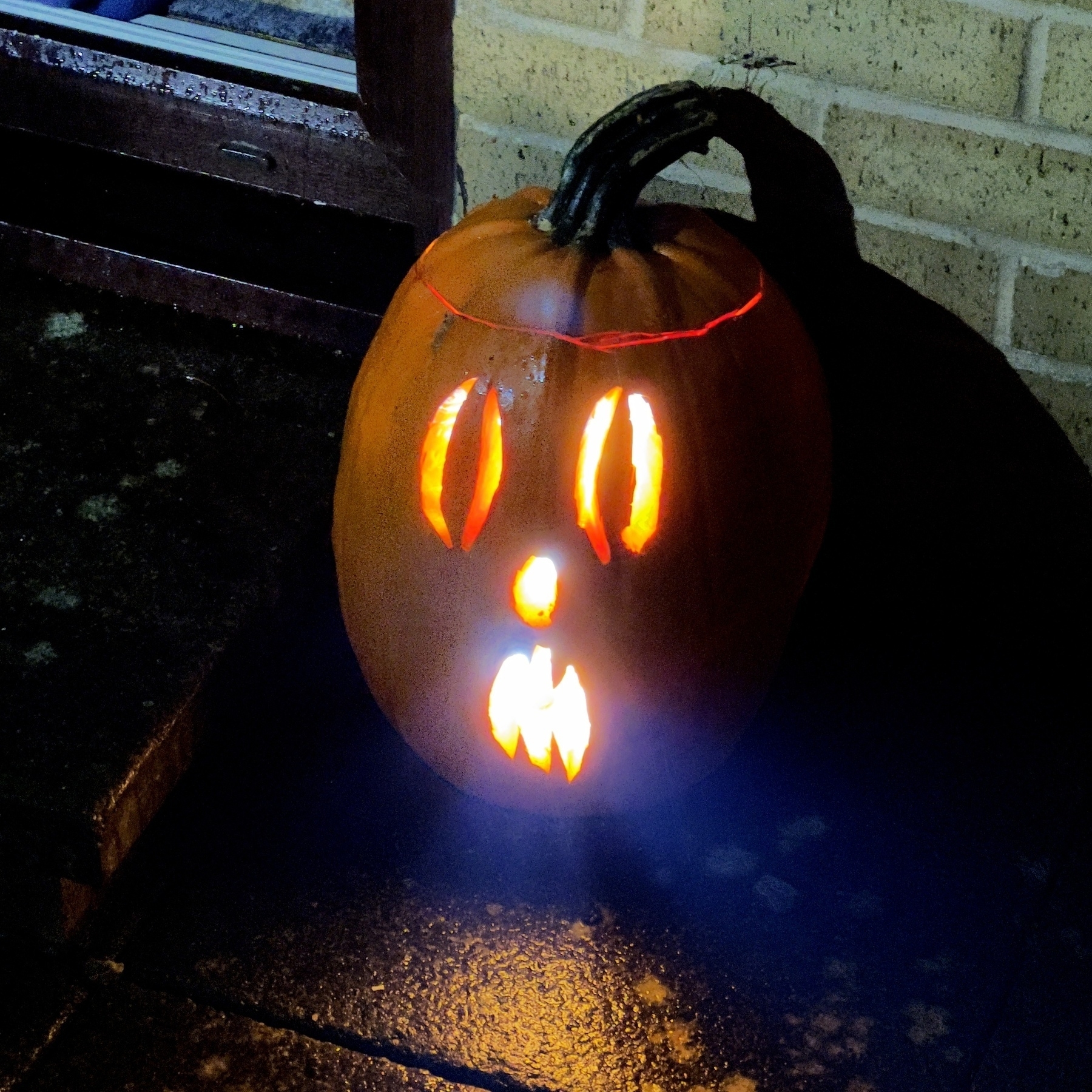 A carved Halloween pumpkin. 