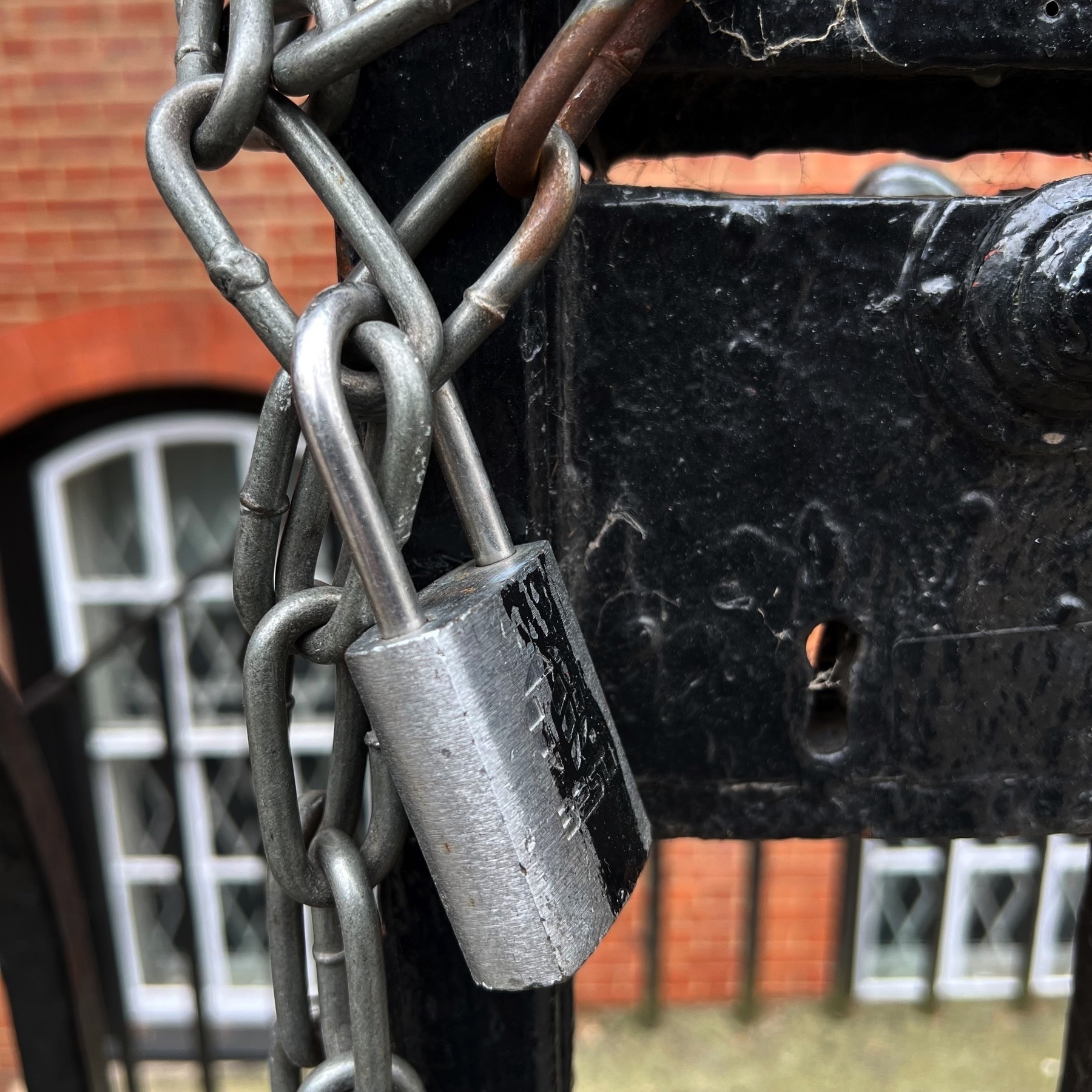 A padlock on a get at City, University of London. 
