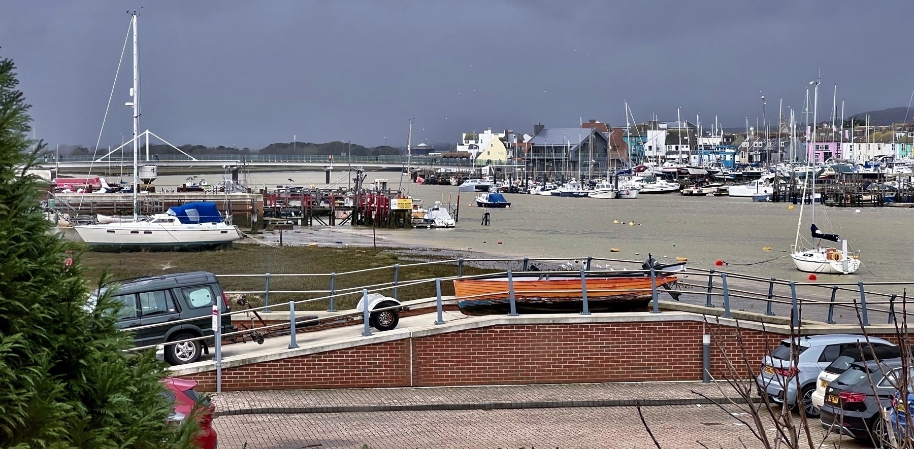A wooden boat being taken off the Adur at the Emerald Quay slipway. 
