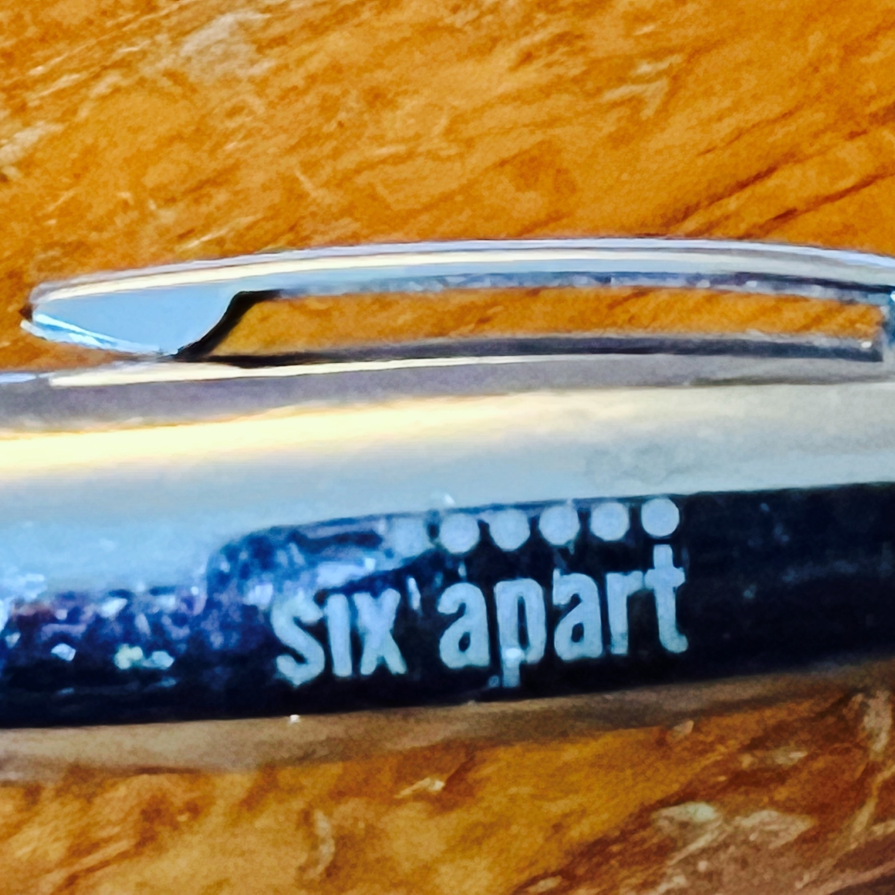 A pen with the Six Apart logo on it.