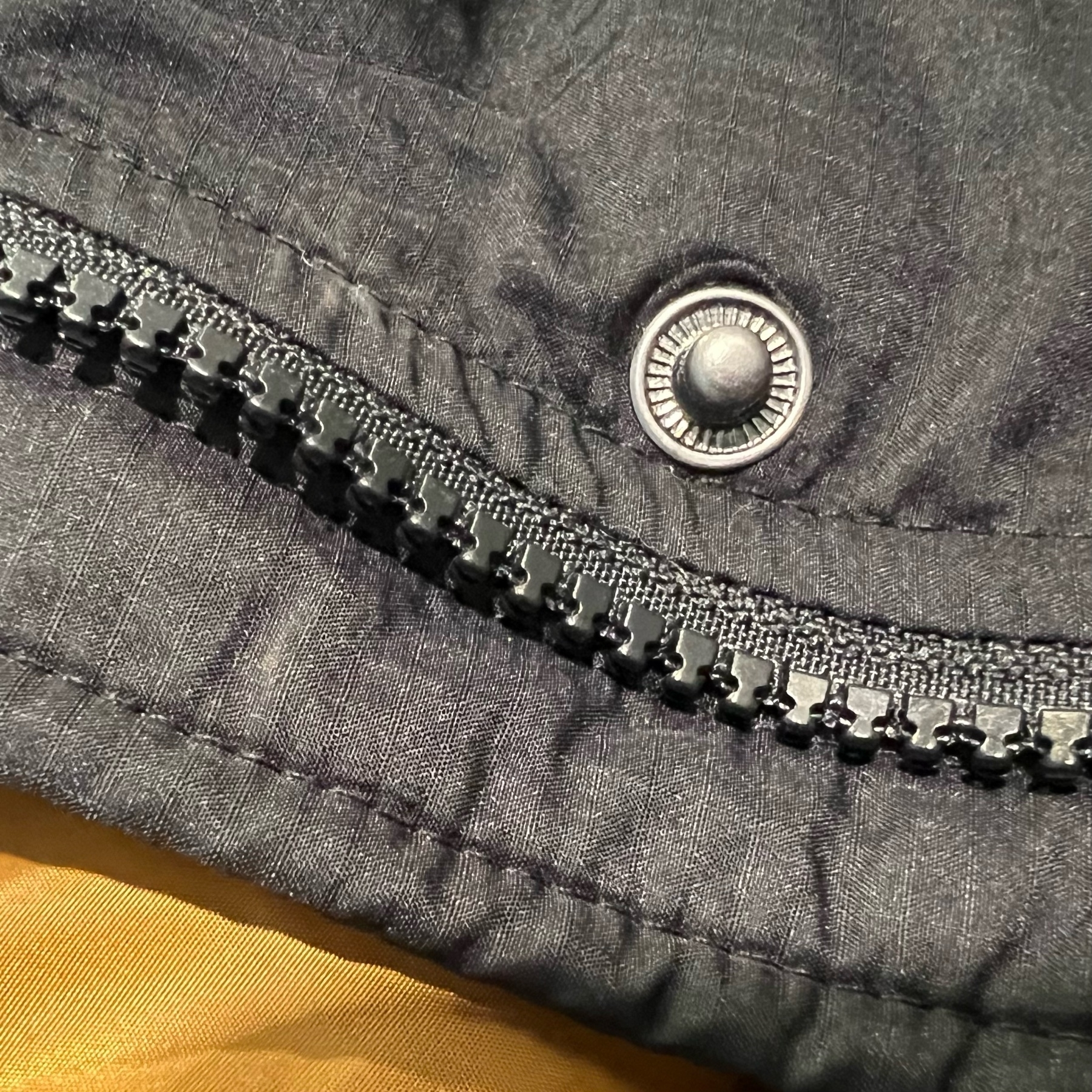 The zip on a Passenger coat.