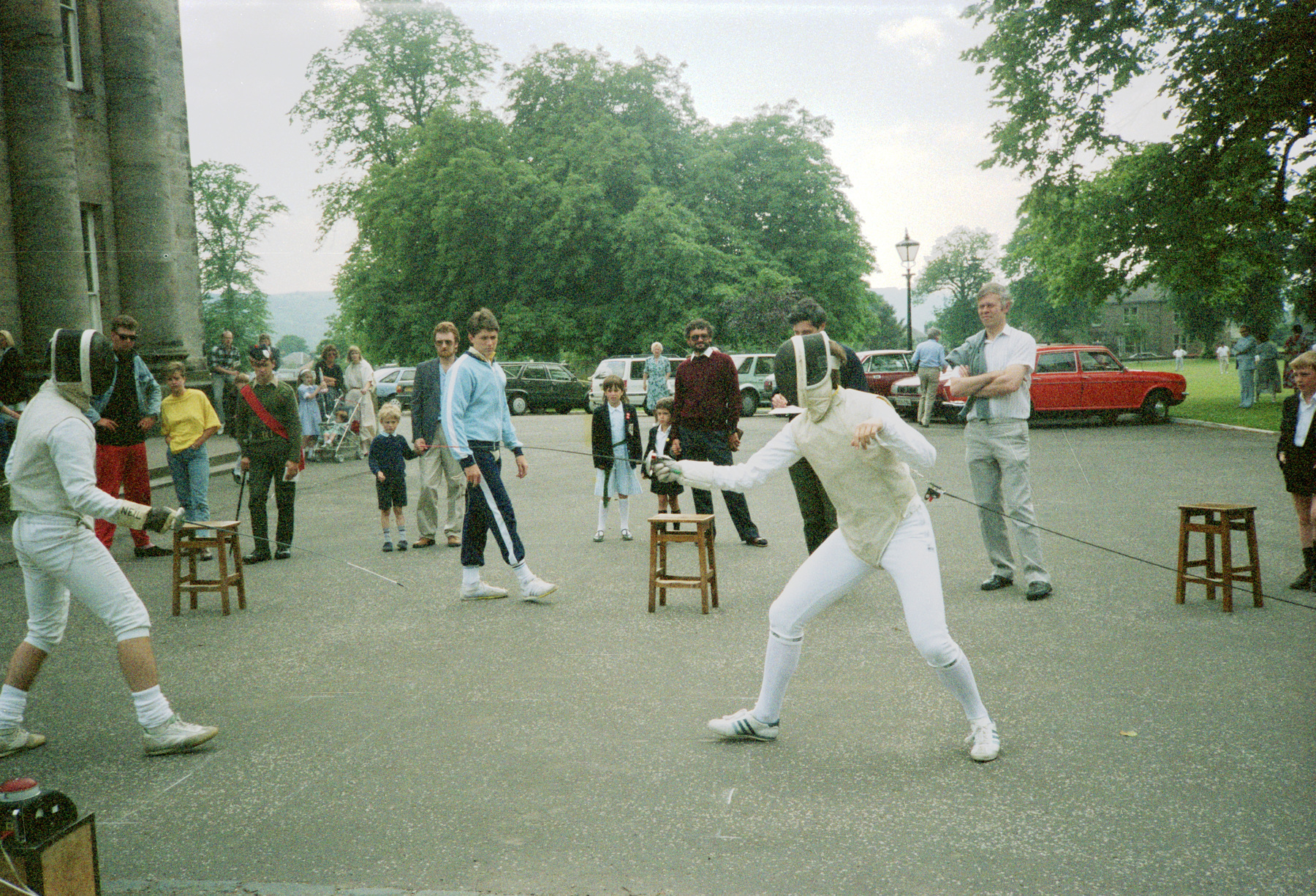 Two fencers fencing foil in the grounds of Dollar Academy, Scotland, in the late 1980s. 